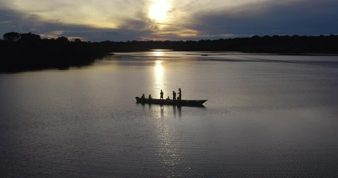 boat at sunset in amazonas river