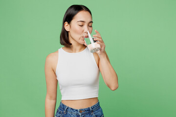 Young woman wear white clothes hold transparent glass drink clear fresh pure still water close eyes...