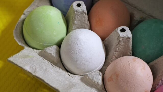 Happy Easter, colorful eggs on yellow background. Close-up of the slider.