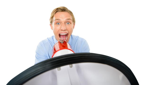 An excited young man standing and using a megaphone to announce some good news isolated on a png background.