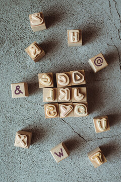 Overhead view of wooden stamps with capital letters