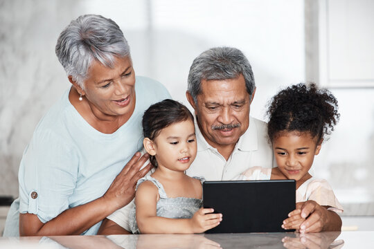 Learning, Grandparents And Kids With Tablet In Home, Playing Online Games Or Educational App. Bonding, Touchscreen Or Care Of Happy Family Watching Movie, Film Or Video On Digital Technology In House