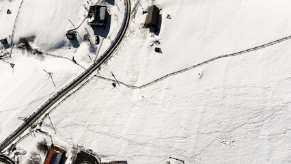 Top view of a snowy city in the mountains, bird's eye view, snow, cold