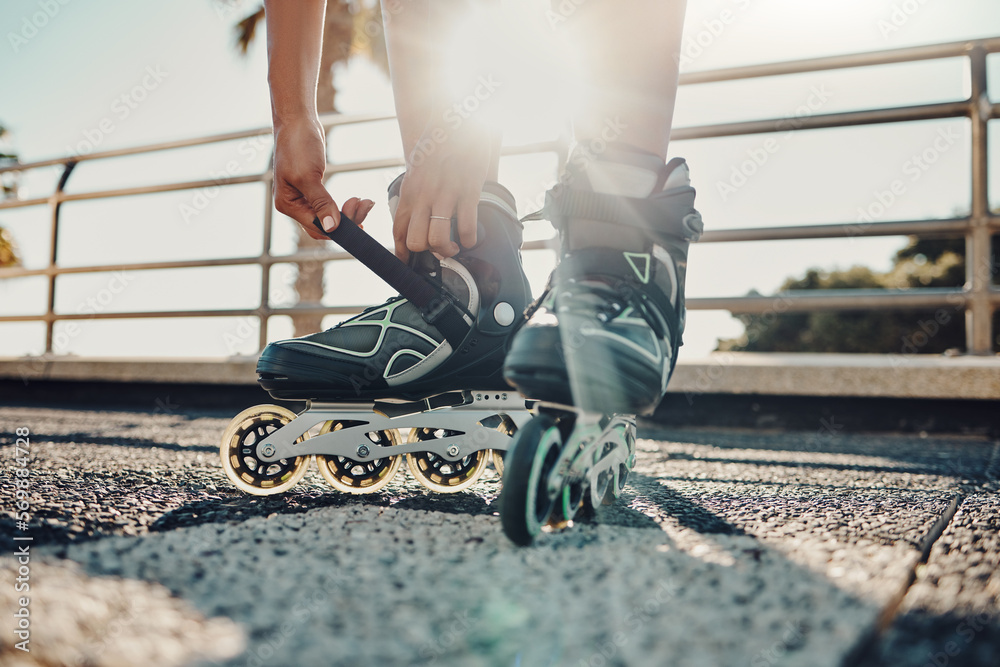 Wall mural fitness, hands and tie roller skates in city to start workout, health and wellness exercise. sports 