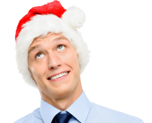 A handsome businessman standing and looking contemplative while wearing a Christmas hat isolated on a png background.
