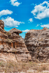 Fototapeta premium Isalo National Park in Ihorombe Region. Wilderness landscape with water erosion into rocky outcrops, plateaus, extensive plains and deep canyons like in Utah. Beautiful Madagascar panorama landscape.