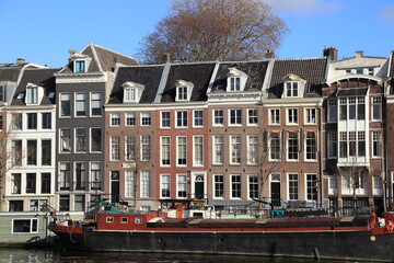 Amsterdam Amstel River House Facades with Houseboat, Netherlands