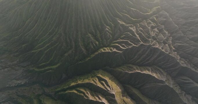 Aerial Top Forward Shot Of Dramatic Volcanic Landscape, Drone Flying Forward Over Clouds - Java, Indonesia