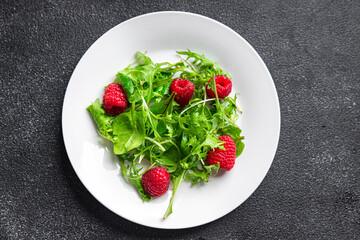 fresh raspberry salad green leaves mix salad healthy meal food snack on the table copy space food background rustic top view
