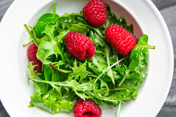 fresh raspberry salad green leaves mix salad healthy meal food snack on the table copy space food background rustic top view