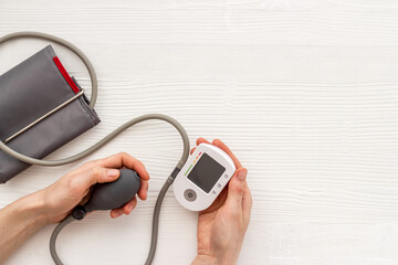 Hand holding medical digital device tonometer. Heart diseases diagnosis concept