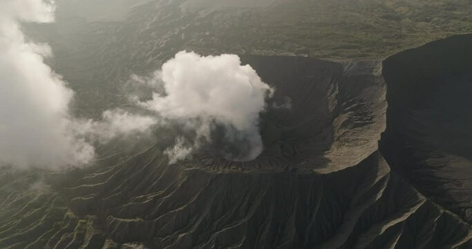 Aerial Panning Shot Of Smoke Emitting From Mount Bromo - Java, Indonesia