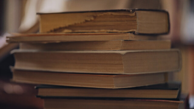 Stack Of Old Books Lying On The Desk, Free Access To Information, Bookstore Or Library