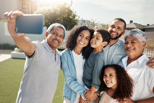 Love, smile and selfie of happy big family bonding, relax or enjoy quality time together in Rio de Janeiro Brazil. Holiday vacation, backyard photo or youth children, parents and grandparents reunion