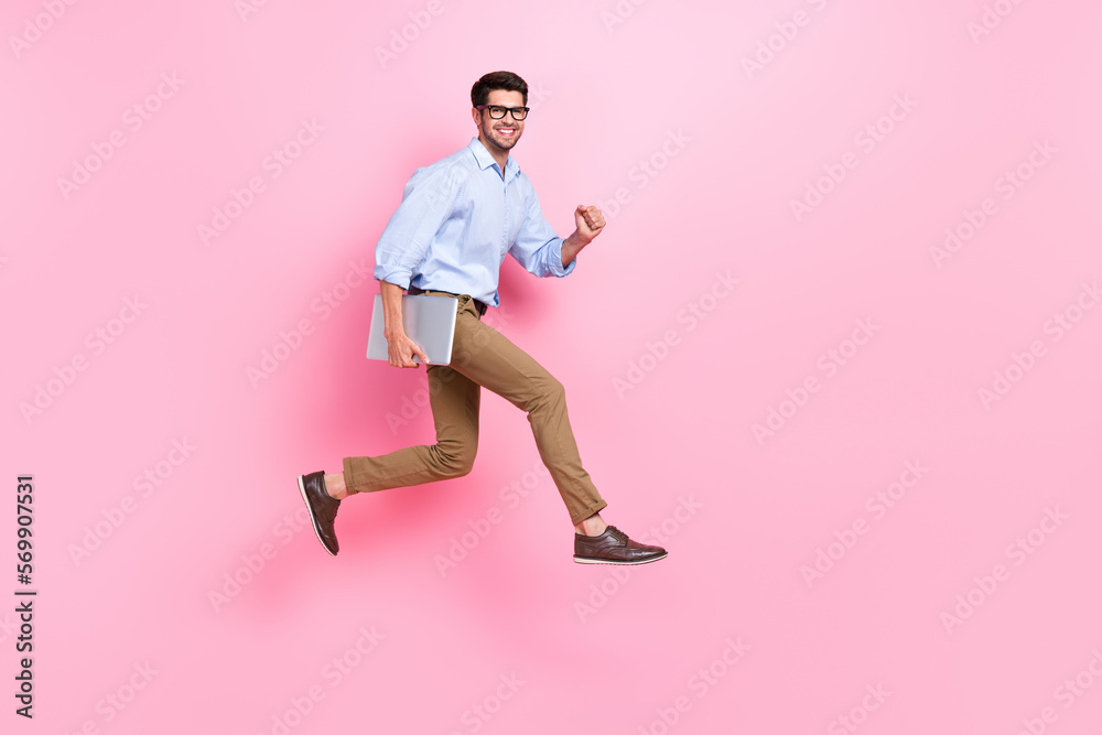 Poster full body length photo of jumping running with netbook funky guy need charge his new hp computer sat