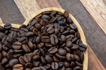 coffee beans in heart-shaped tra,y representing love of coffee