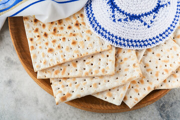 Passover celebration concept. Matzah, red kosher and walnut. Traditional ritual Jewish bread...