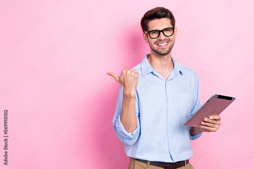 Poster photo of overjoyed man user modern gadgets arm direct empty space demonstrate sale device shop isola