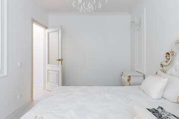 Corridor in with white walls and doors in the apartment