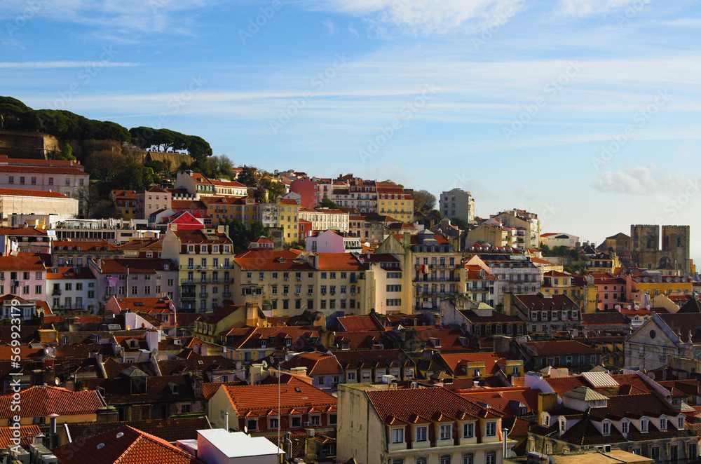 Wall mural Panoramic landscape view of city center of Lisbon. View from top of Santa Justa Lift. Vintage buildings with red tile roofs. Travel and tourism concept. Sunny day