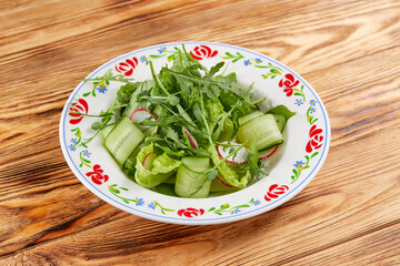 green salad on the wooden table
