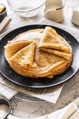 pancakes with butter on a white background with ingredients flour sugar butter