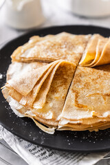 pancakes with butter on a white background with ingredients flour sugar butter
