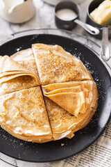 pancakes with butter on a white background with ingredients flour sugar butter