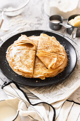 pancakes with butter on a white background with ingredients flour sugar butter
