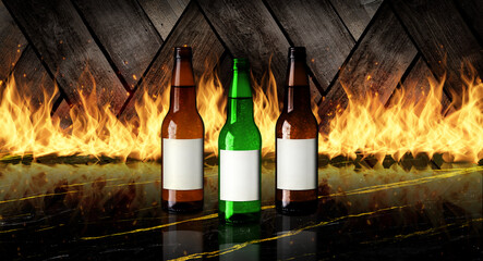 Three bottles of varying ale on golden black marble with burning wood background