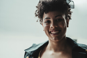 Horizontal portrait of smiling latina woman looking at camera. 