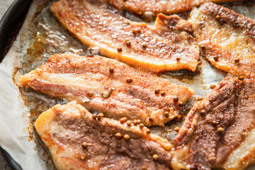 Whole pork belly grilled in an oven pan