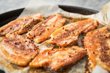 Whole pork belly grilled in an oven pan