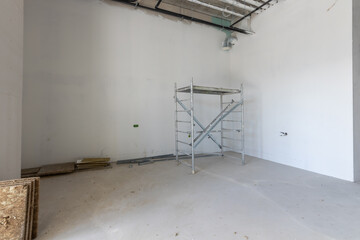 Room is under renovation or under construction. Scaffolding in the office under construction.
