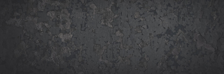 Obraz premium Dark wide panoramic background. Peeling paint on a concrete wall. Faded dark texture of old cracked flaking paint. Weathered rough painted surface with patterns of cracks. Shaded background for design