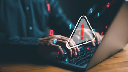 user is using computer with triangle caution warning sign for notification error and maintenance...