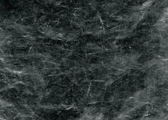Fototapeta na wymiar White scratches and dust on black background. Vintage scratched grunge plastic broken screen texture. Scratched glass surface wallpaper. Space for text.