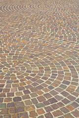Fototapeta premium New paving made with porphyry stone blocks of cubic shape in a p