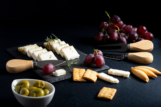 Set of various cheese on black board