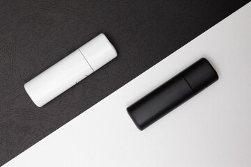 Electronic cigarettes on a white and black background. Smoking concept