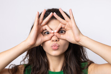 Smiling girl gesturing OK sign with her hand