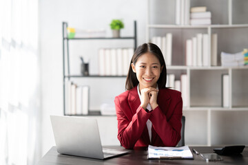 Portrait of Confident asian businesswoman sitting in the modern office room.