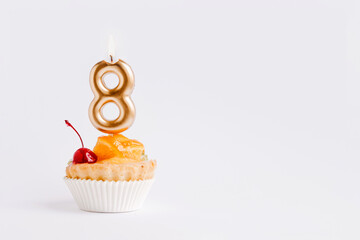 Golden candle with number eight on a cake on white background 8 march greeting card Women's Day.