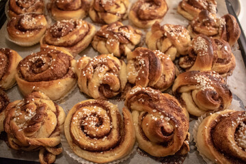 Freshly baked homemade Swedish cinnamon rolls with pearl sugar