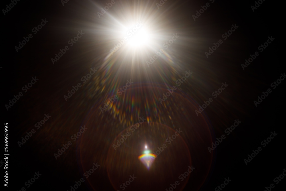 Poster Easy to add lens flare effects for overlay designs or screen blending mode to make high-quality images. Abstract sun burst, digital flare, iridescent glare over black background.