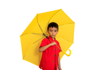 boy fashion  wearing a Chinese-style shirt holding a yellow umbrella poses for a photo shoot.