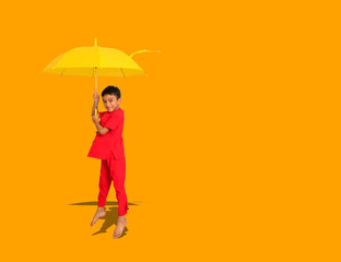 boy fashion  wearing a Chinese-style shirt holding a yellow umbrella poses for a photo shoot.