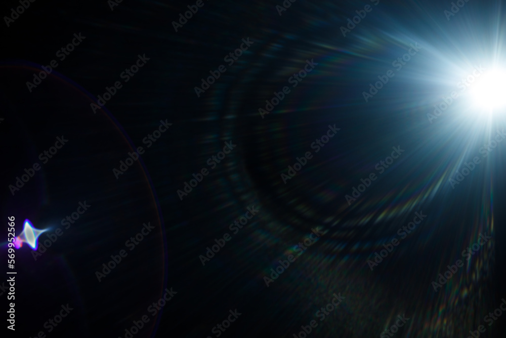 Poster Easy to add lens flare effects for overlay designs or screen blending mode to make high-quality images. Abstract sun burst, digital flare, iridescent glare over black background.