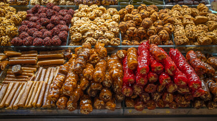 Wide range of sweets at the Grand Bazaar in Istanbul, Turkey. Historic market is popular tourist destination and one of the oldest markets in the world. Turkish sweets at the spice marketplace.