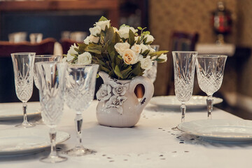 A set table in retro style in the restaurant.